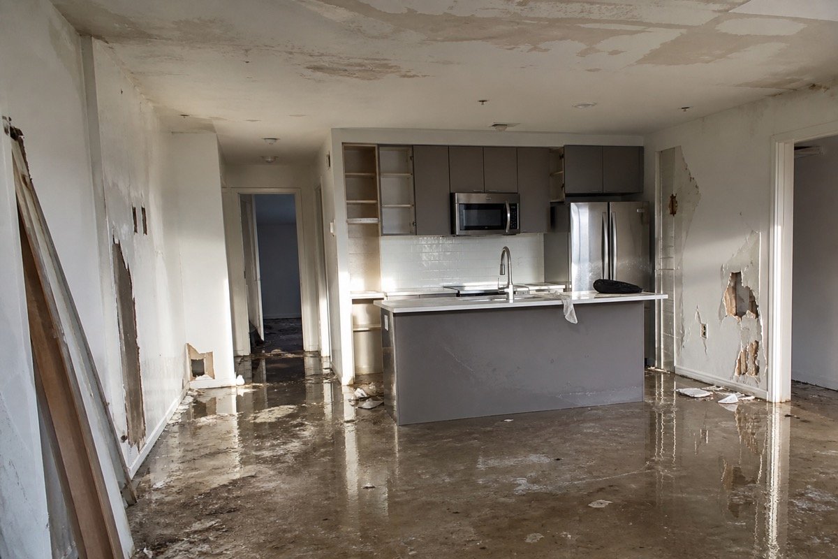 Multi-unit water damage — burst supply line — before