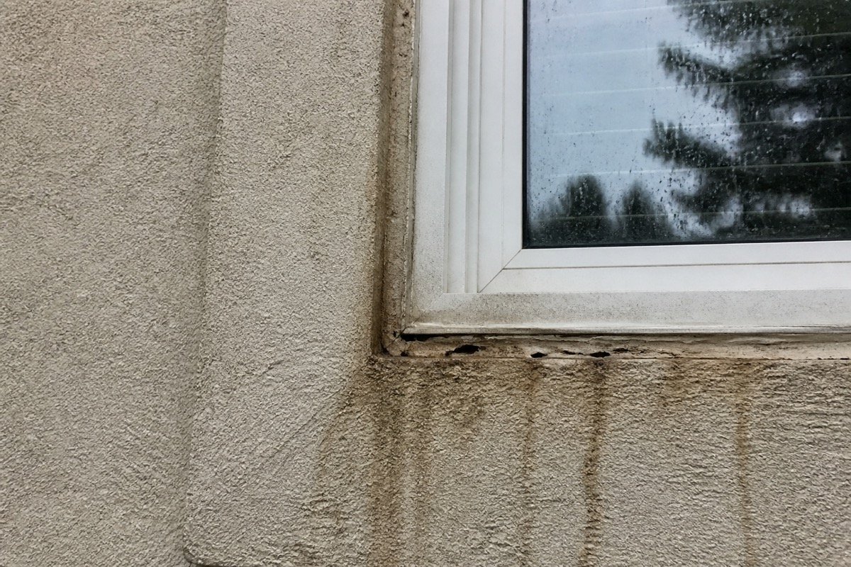 Window and door leak repair — single-family stucco home — before